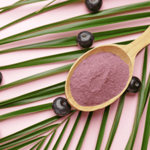 A wooden spoon with purple powder on it